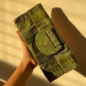 great condition snakeskin clutch has suede interior